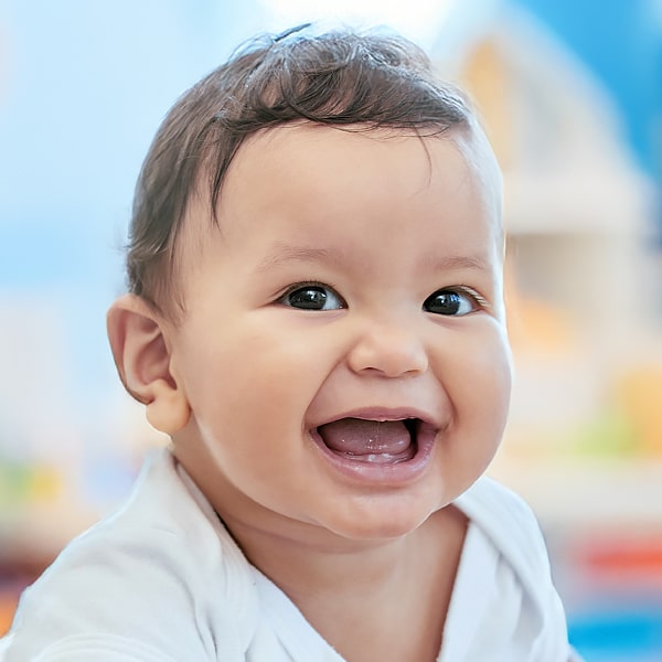 A smiling infant, showcasing happiness and joy