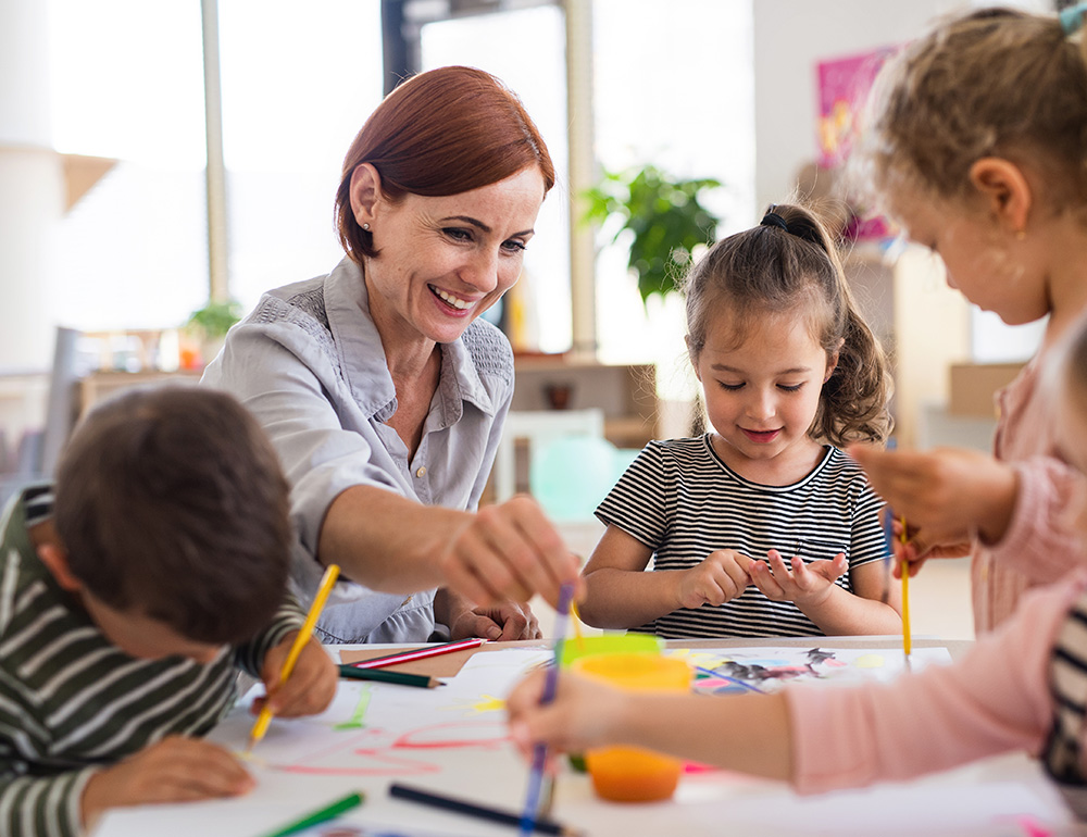 An teacher reading a story to engaged children, fostering imagination and connection