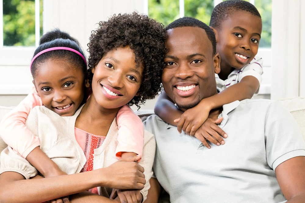 A joyful family portrait with smiling parents and children, highlighting togetherness and balance