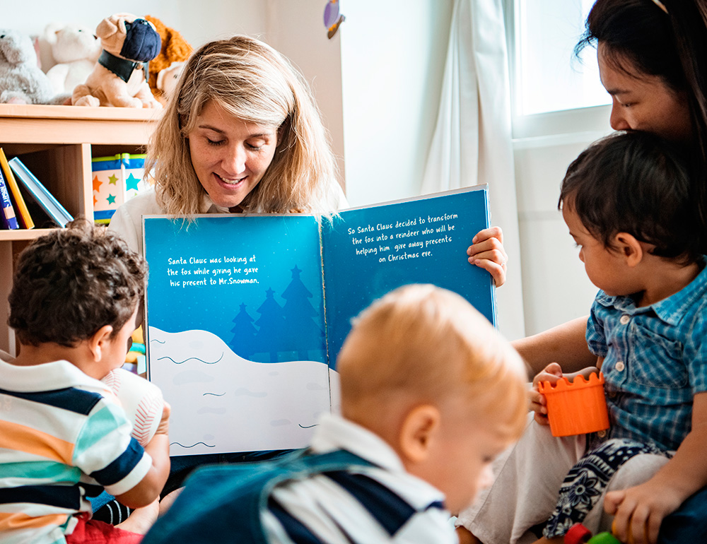 An teacher reading a story to engaged children, fostering imagination and connection